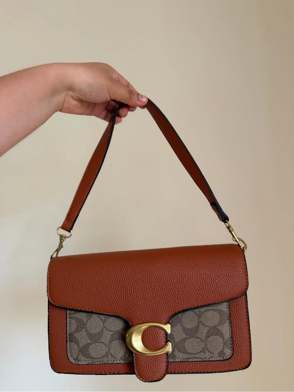 Brown Pebbled Leather Shoulder Bag with Signature Accent